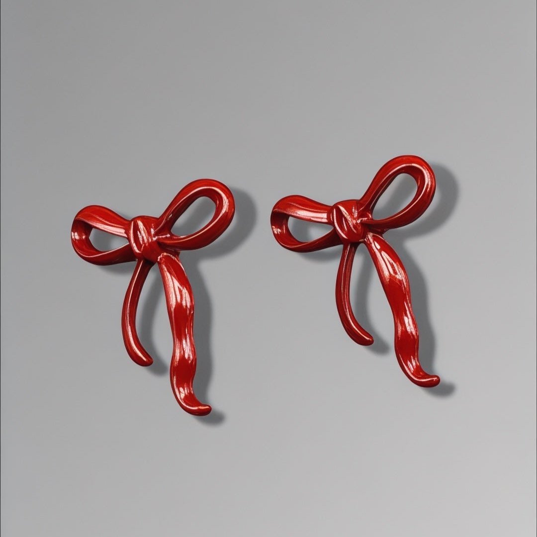 Red bow statement earrings by Alineh